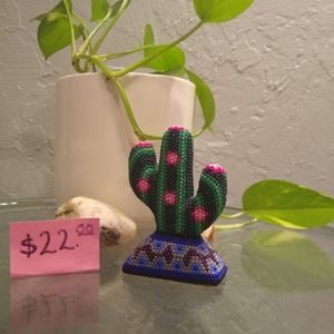 This is a wooden cactus with beads